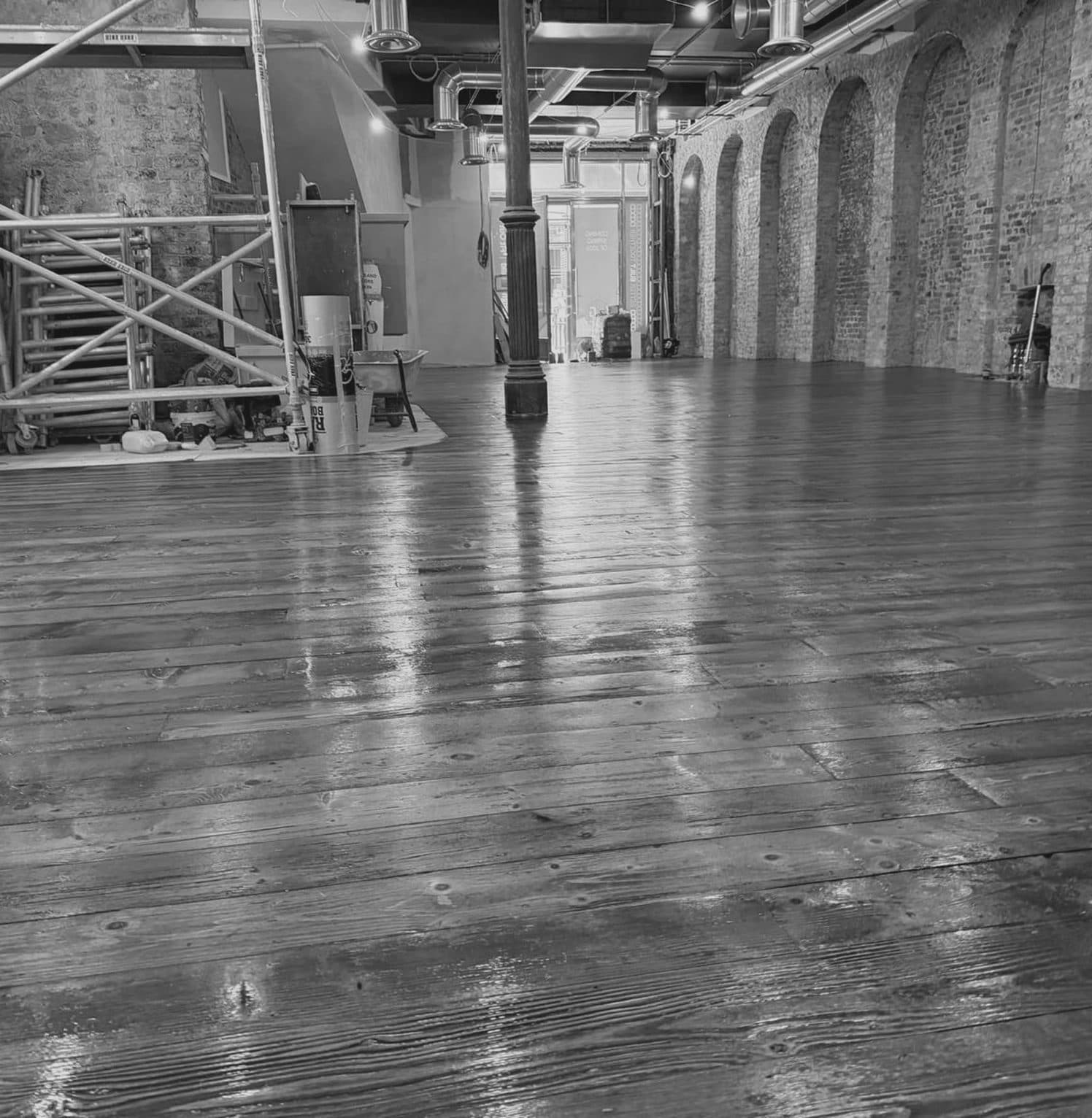 The dining room at 25 Suffolk Street, brick arches and timber floor