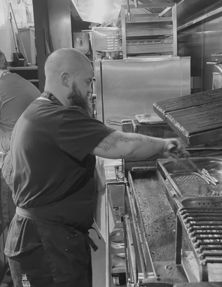 A chef working the pass